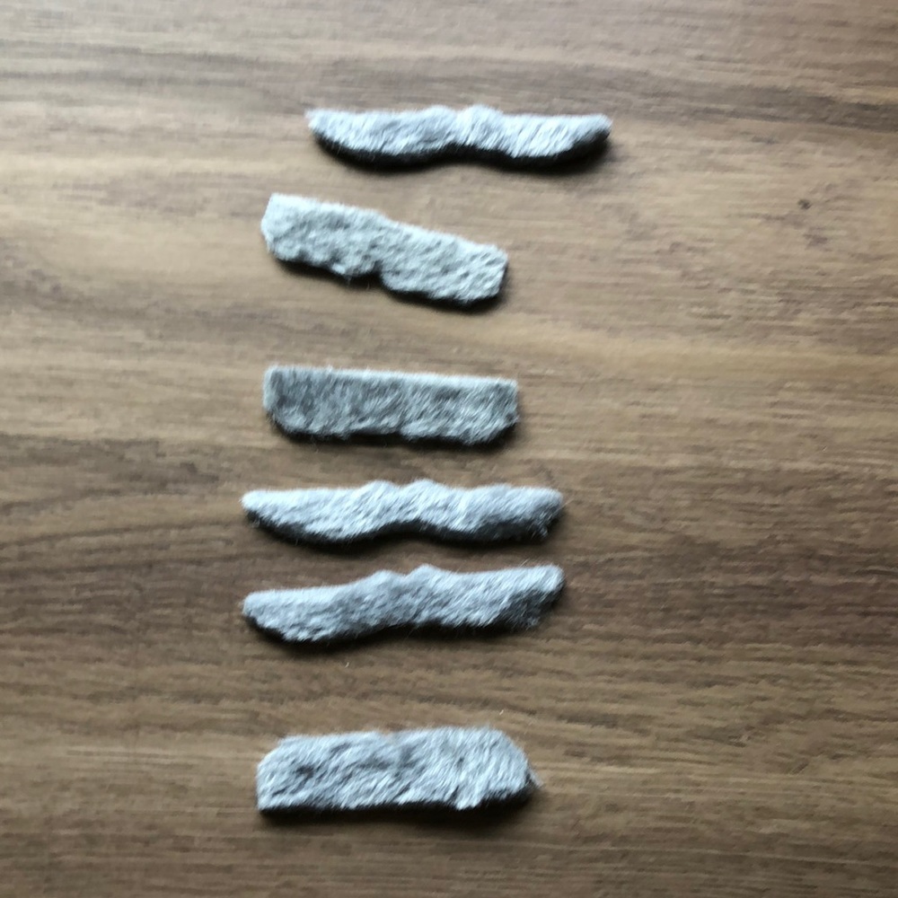 Lot of six peel and stick obviously fake mustaches in gray